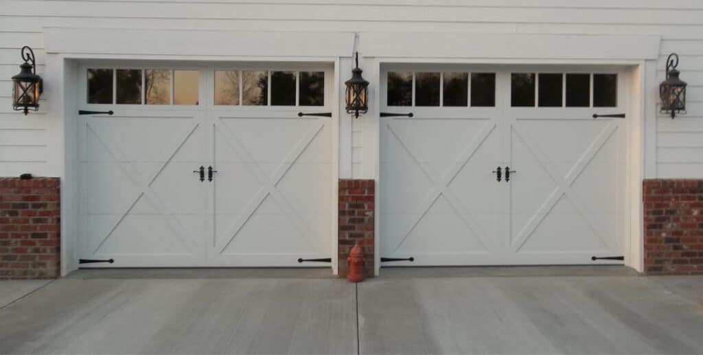 Insulated garage door on an attached home, a quieter and more energy-efficient replacement option.